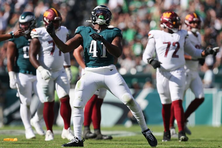 Eagles linebacker Nicholas Morrow celebrates after taking down Washington Commanders quarterback Sam Howell in the third quarter on Sunday, October 1, 2023 in Philadelphia.
