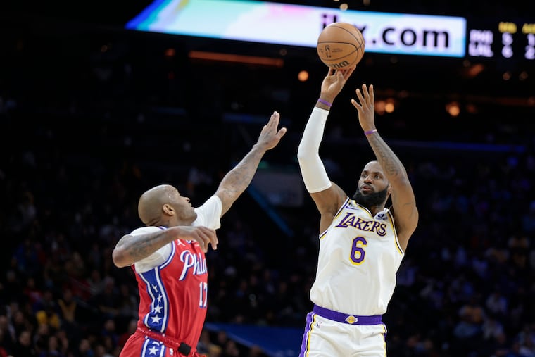 The Sixers' P.J. Tucker tries to block a shot by LeBron James during the Los Angeles Lakers at Philadelphia 76ers game at the Wells Fargo Center on Dec. 9, 2022.