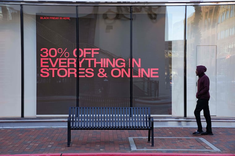 Shoppers browse for Black Friday deals at the Atlantic Station outdoor mall, Friday, Nov. 28, 2025, in Atlanta.