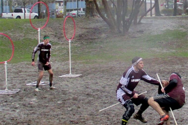 A Swarthmore attacker is leveled by Lock Haven defender Josh Morules close to the team's goal posts protected by Adam Paterson. Lock Haven prevailed in the match at the Clark Park Cup quidditch tournament.