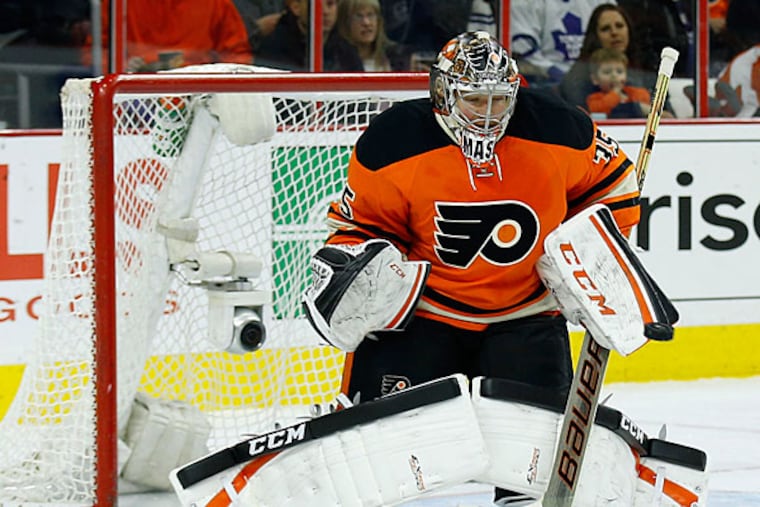 Flyers' goalie Steve Mason knows how to communicate with his defensemen on which shots to stop and which ones to let him take care of. (Yong Kim/Staff Photographer)