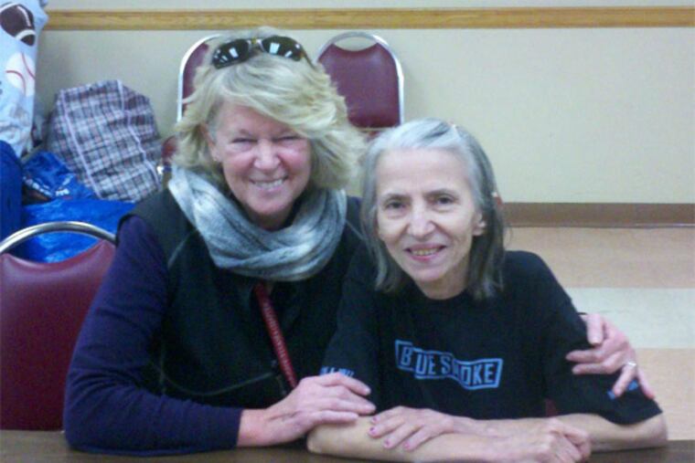 Danelle Stoppel with a client in New York, where she volunteered during Hurricane Sandy recovery. (Red Cross Southeastern Pennsylvania)