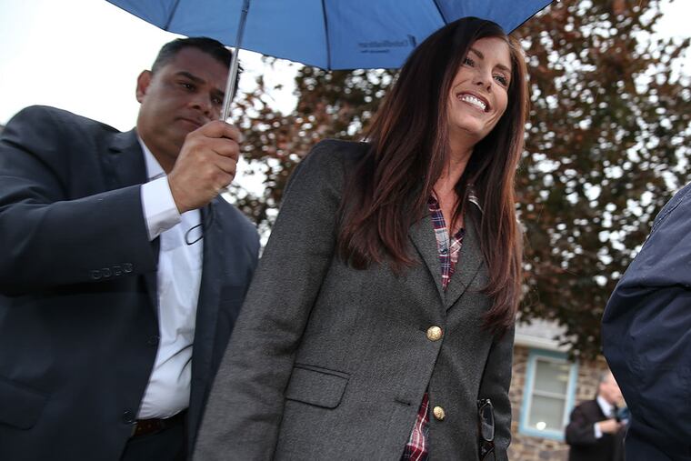 Attorney General Kathleen Kane leaves arraignment Thursday. (STEVEN M. FALK/STAFF PHOTOGRAPHER)