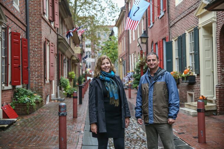 Maiken Scott, left of WHYY and Michael Yudell of Drexel have created a free audio walking tour that chronicles the city's Yellow fever epidemic of 1793. Here at Elfreth's Alley in the Old City neighborhood, Tuesday, October 22, 2019.