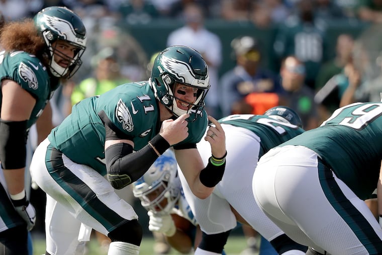 Eagles quarterback Carson Wentz audibles in the third quarter against the Lions.