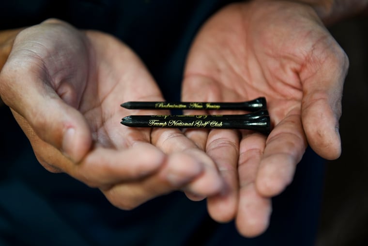 A former undocumented worker holds golf tees from Trump National Golf Club Bedminster in New Jersey.