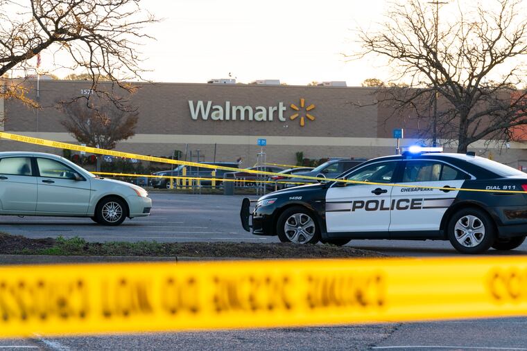 Law enforcement work the scene of a mass shooting at a Walmart in Chesapeake, Va., on Wednesday.