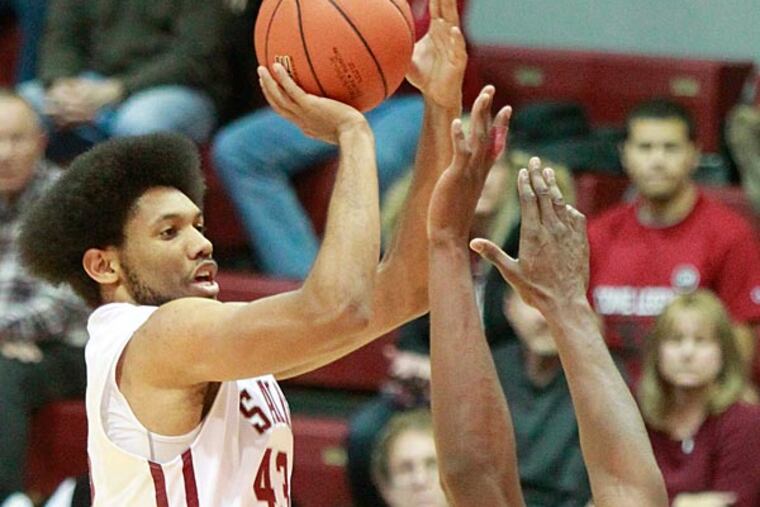 DeAndre' Bembry shoots a 3-pointer. (Charles Fox/Staff Photographer)