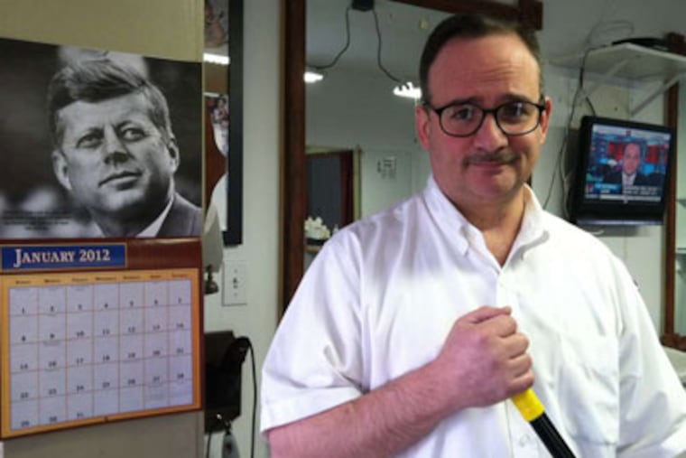 Drexel Hill barber Mike LoBiondo and his wife, Dolores, put their medical care on hold after losing adultBasic coverage. (Daniel Rubin / Staff)