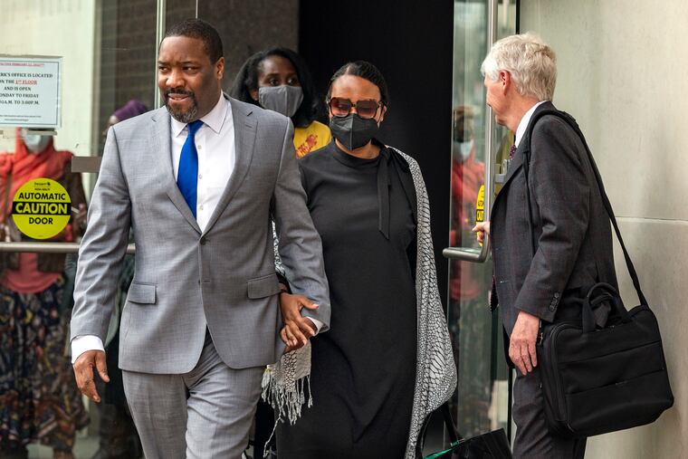 Attorney Patrick Egan (right) holds the door for Philadelphia City Councilmember Kenyatta Johnson and his wife, Dawn Chavous, as they leave the federal courthouse in Center City after the jury ended deliberations for the day in their bribery case.