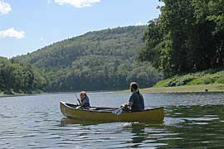 Canoeists paddle near Dingmans Campground on the Delaware River.