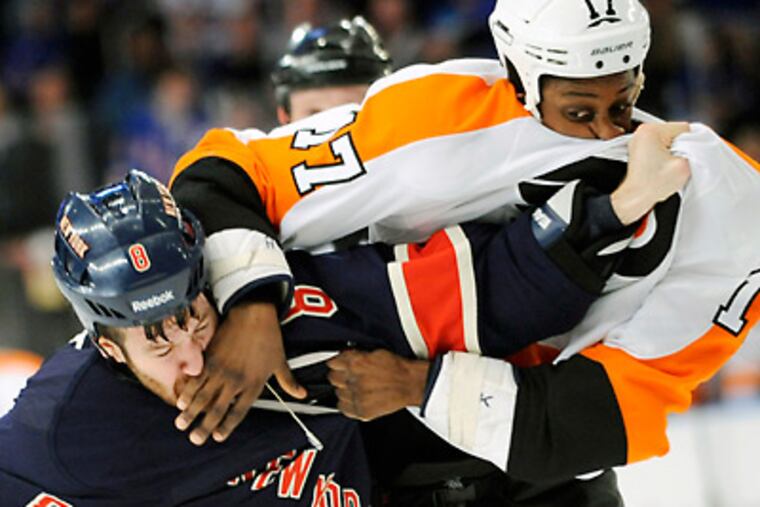 Flyers' Wayne Simmonds fights with Rangers' Brandon Prust during the first period. (AP Photo/Bill Kostroun)