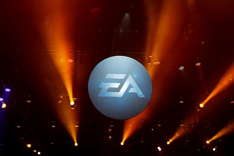 The logo for Electronic Arts is displayed during the Electronic Entertainment Expo in Los Angeles on June 12, 2013. If the acquisition closes as anticipated, it will end EA’s 36-year history as a publicly traded company.