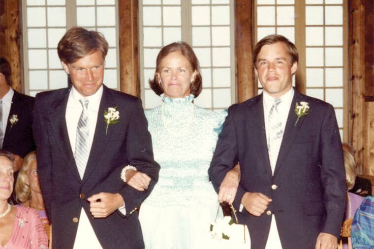 George Bell (left) and his brother Jamie with their mother at their sister Sophie's wedding in 1984.