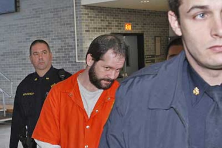 Sheriff's officers escort William Foster, accused of homicide in the auto death of Philadelphia Police Sgt. Timothy Simpson, into a Bucks County courtroom Thursday. ( Michael S. Wirtz / Staff Photographer)