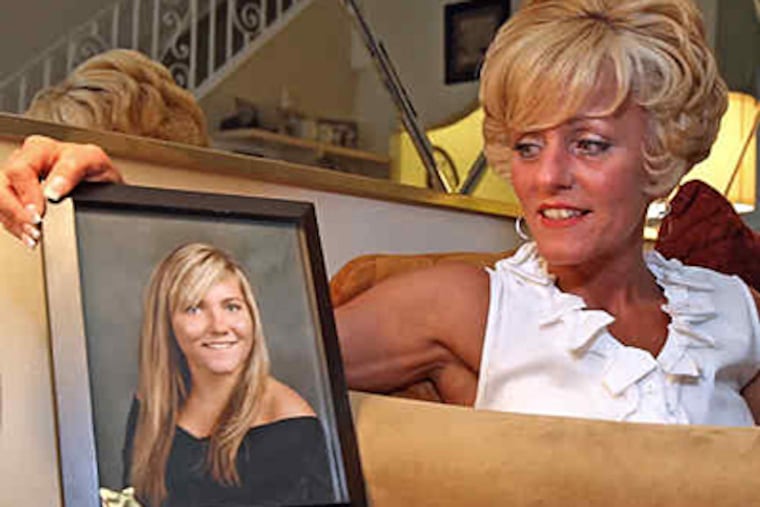 Denise Gallagher, with a photo of her daughter Lacey, who was killed two years ago in a prom-night car wreck. (Steven M. Falk / Staff Photographer)