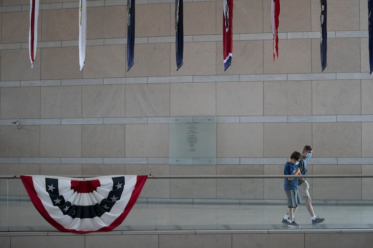 Visitors wear masks inside the National Constitution Center in Philadelphia on Friday, Aug. 07, 2020. The museum reopened for the first time this week since the start of the pandemic. Admission is free until Sept. 5.