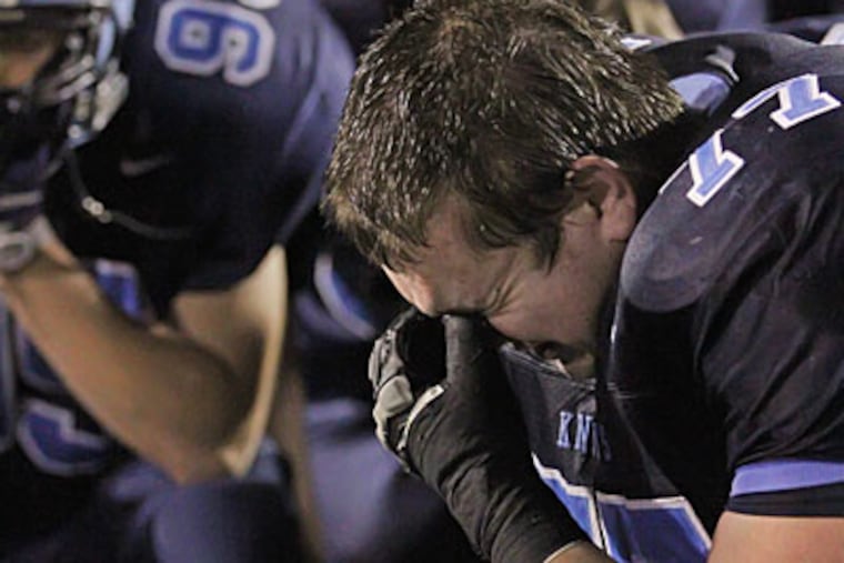 TJ Smink can't hold back the tears after North Penn lost to Central Dauphin, 14-7. (Michael Bryant / Staff Photographer)
