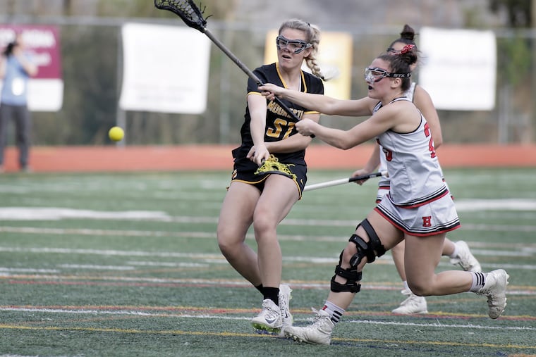 Moorestown's Dylan Silar (left) scores the team's sixth goal.
