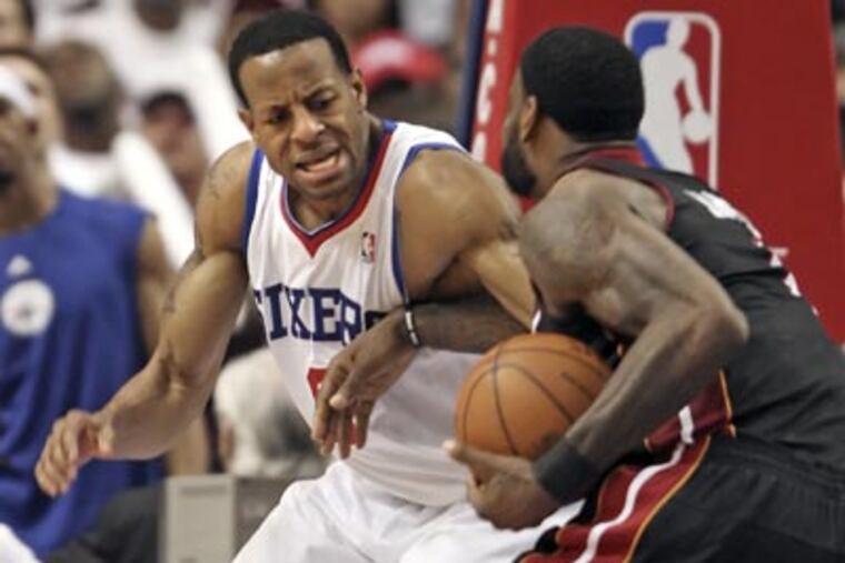 Andre Iguodala battles the Heat's LeBron James during the fourth quarter of Game 3. (Steven M. Falk/Staff Photographer)
