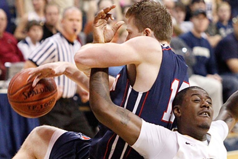 Pitts' Dante Taylor and Penn's Andreas Schreiber battle for a rebound during the second half. (AP Photo/Keith Srakocic)
