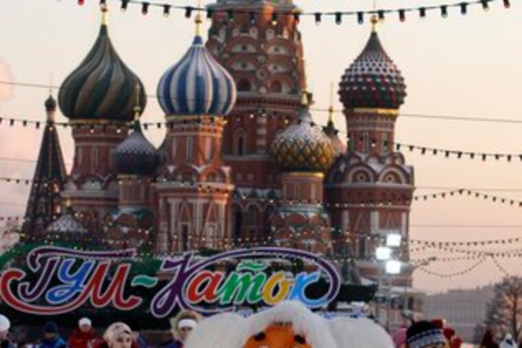 People skate in Moscow's Red Square in front of St. Basil Cathedral. The city has set up the rink the last few years.