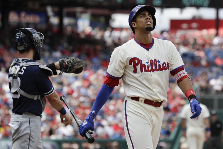 Aaron Altherr walks back to the dugout after striking out with the bases loaded during the first game of Sunday's doubleheader.
