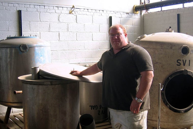 Tom Kehoe with Yards' original brewing equipment.