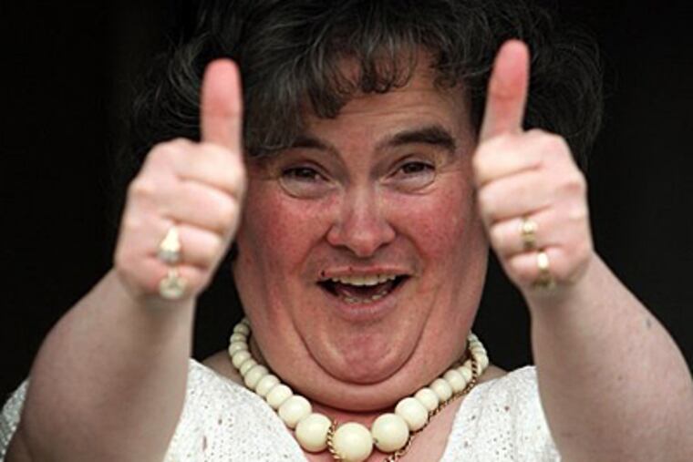 Susan Boyle, who's performance on the television show "Britain's Got Talent" wowed the judges, gives the thumbs up at her home in Blackburn, Scotland. (AP Photo/Andrew Milligan-pa)