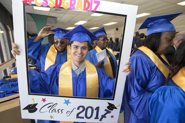 Hector Ceballos graduates in a citywide high-school equivalency graduation ceremony.