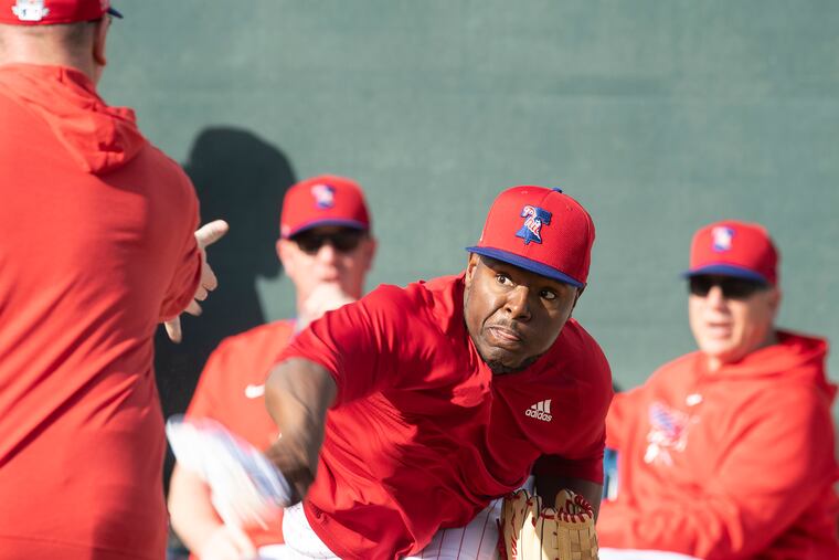 Phillies pitcher Hector Neris warms up during spring training in Clearwater.