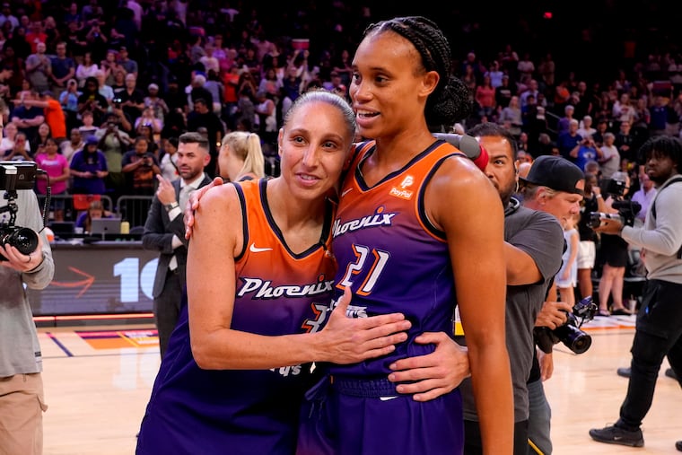 Phoenix Mercury guard Diana Taurasi (3) hugs teammate Brianna Turner after a WNBA basketball game in which Taurasi, the WNBA's all-time leading scorer, scored her 10,000th point.