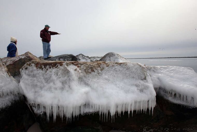Tim Burdon of the N.J. Beach Buggy Association atop frozen rocks at Island Beach State Park. Much of the jetty at the southern end of the park was washed away during Sandy.