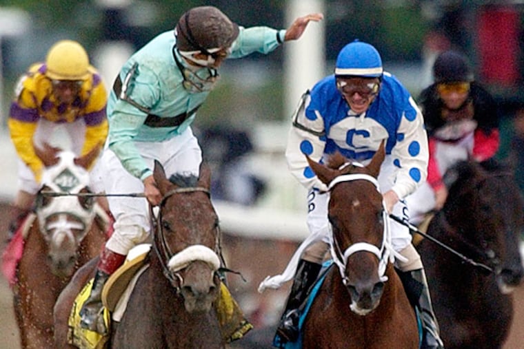 Jockey Edgar S. Prado, left, aboard Birdstone, reacts after winning the Belmont Stakes as jockey Stewart Elliott, right, aboard Smarty Jones looks on at Belmont Park, Saturday, June 5, 2004, in Elmont, N.Y. Smarty Jones finished second. (Frank Franklin II/AP)