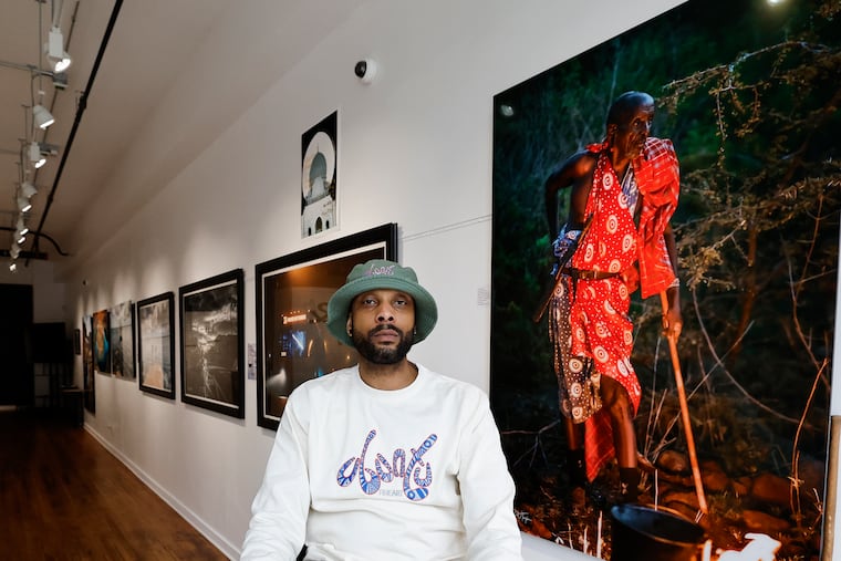 Steven C.W. Taylor with his fine art photography at the Ubuntu Fine Art gallery in Germantown.