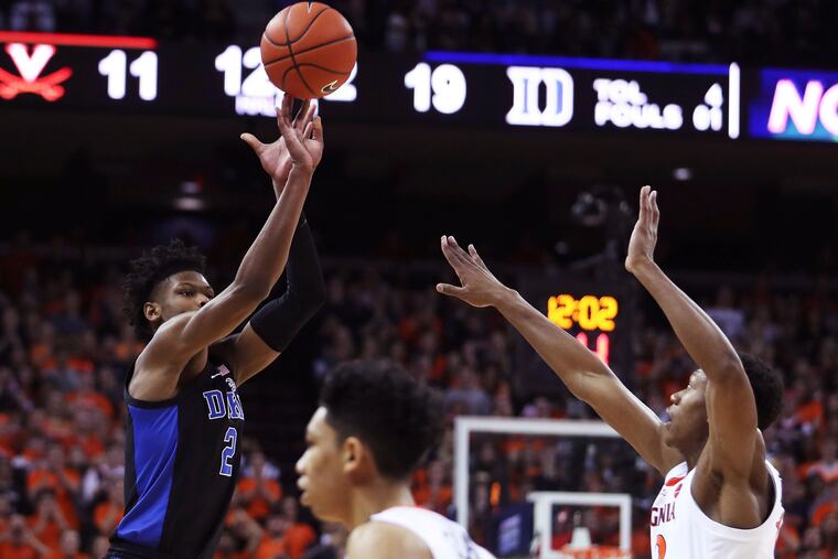 Duke forward Cam Reddish (2) shoots over Virginia's guard De'Andre Hunter (12) during the first half of an NCAA college basketball game Saturday, Feb. 9, 2018, in Charlottesville, Va. (AP Photo/Zack Wajsgras)