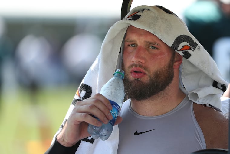 Lane Johnson cools off after the Eagles training camp in Philadelphia on July 30, 2019.