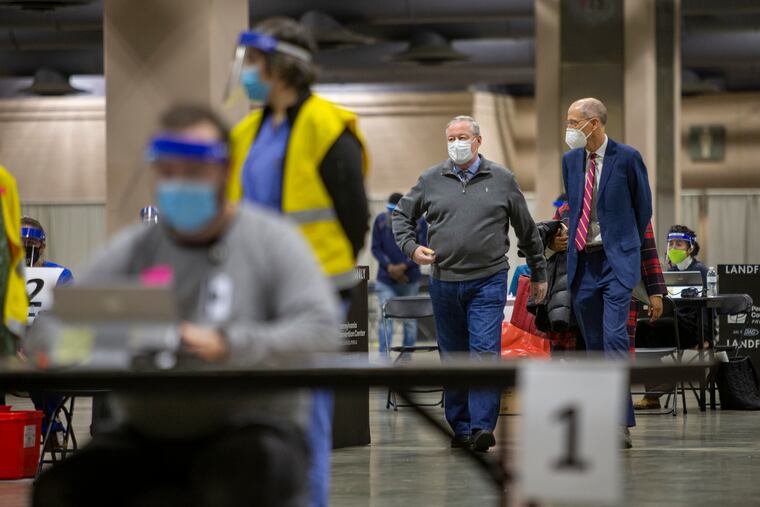 Philadelphia Mayor Jim Kenney and Health Commissioner Thomas Farley tour the city's new COVID-19 vaccination center inside the Pennsylvania Convention Center on Wednesday.