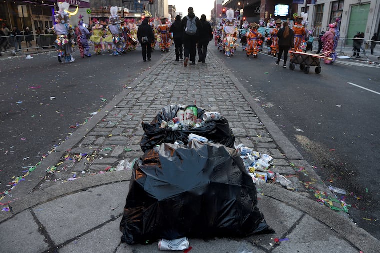 Trash bags are placed on a median strip on South Broad St.