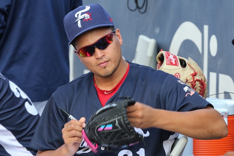 Victor Arano signing a glove for a fan last month. The pitcher missed the first few months of the season with an elbow injury, but the Phillies wanted to see him in the majors for the final few weeks of the season.