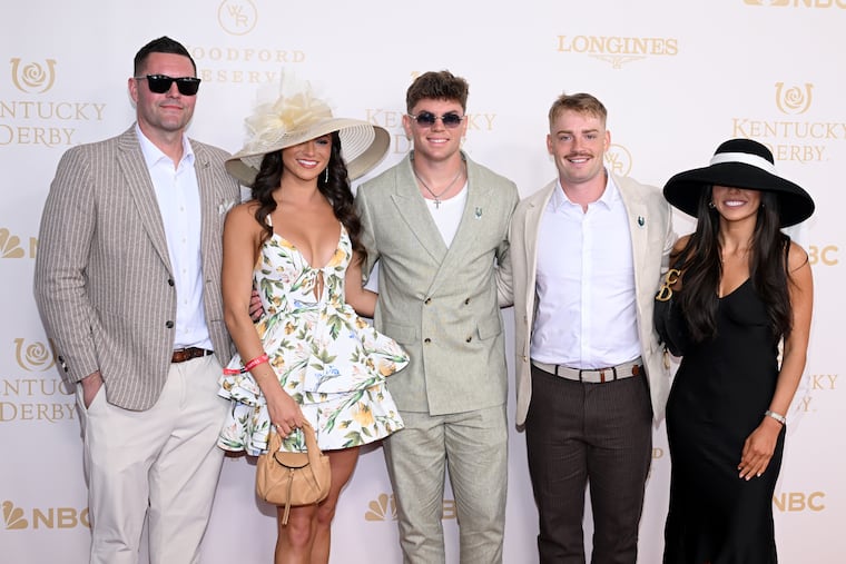 Cooper DeJean (center) poses with Abby Summers (second from left) and others on the red carpet of the Kentucky Derby on Saturday.