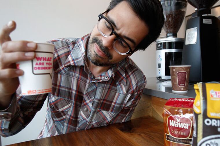 Aaron Ultimo with the "other" brews. See his impressions <a href="http://media.philly.com/images/050913_0509coffee_DNgraf.jpg" target="_blank"> here</a>.