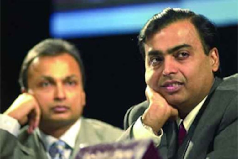 The Ambani brothers, Amil (left) and Mukesh, were ranked in March as two of the six richest people in the world. That was before their joint net worth dropped by more than $50 billion.