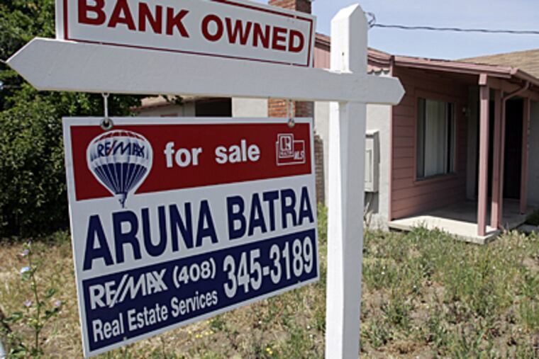 A foreclosure sign posted at a Calif. home. Home sales locally and nationally are off.. (AP)