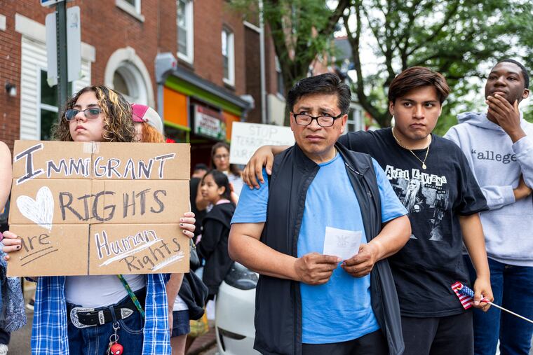 Rogelio Torres, of Norristown, and his son Brandon Torres, 20, are out showing their support for their community during a rally in Norristown, Pa., on Saturday, June 7, 2025.