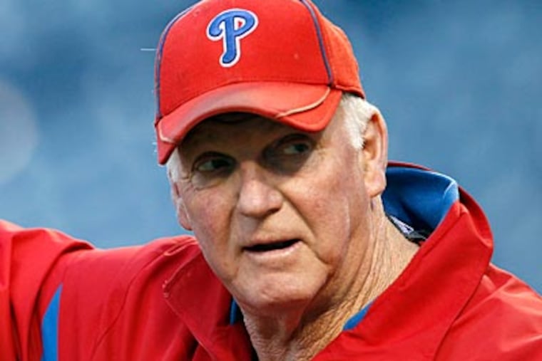 Charlie Manuel and the rest of the Phillies coaching staff will return in 2012. (Yong Kim/Staff Photographer)
