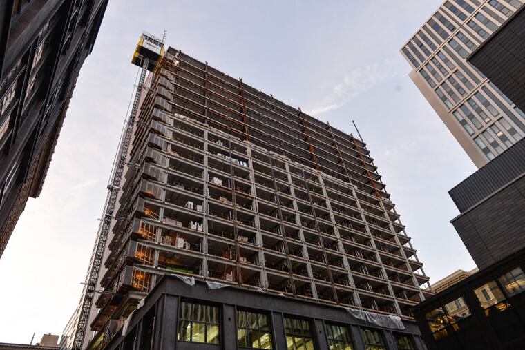 The residential tower under construction in November 2017 will be part of the East Market mixed-use development. With a healthy real estate market, the 10-year tax abatement benefit only flows to developers.