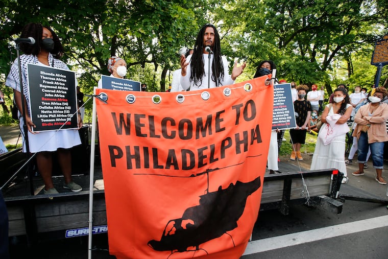 MOVE member Mike Africa speaks during a rally for the the 36th anniversary of the MOVE bombing along Osage Avenue and Cobbs Creek Parkway in West Philadelphia in 2021.