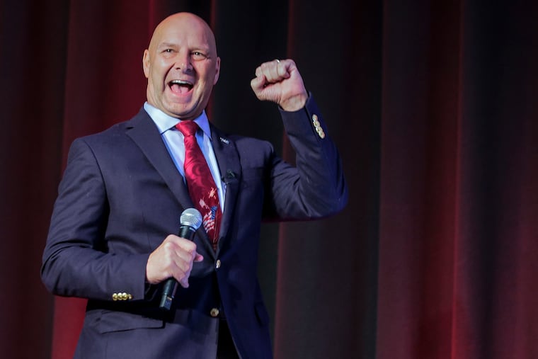 State Sen. Doug Mastriano, the Republican nominee for governor in Pennsylvania, pumps his fist during a speech Friday in Pittsburgh.