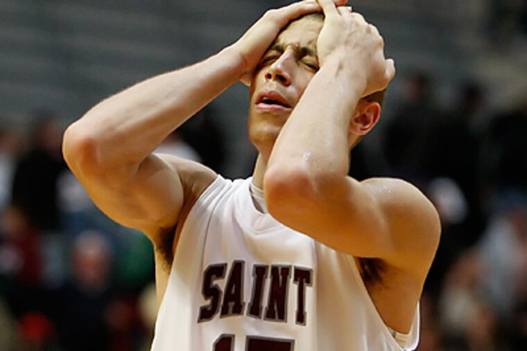 St. Joseph's Garrett Williamson can't believe his team let Temple sneak past them. ( Ron Cortes / Staff Photographer )